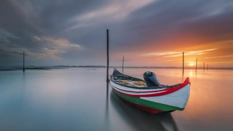 Serene Sunset Sailboat Scene wallpaper