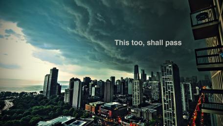 Inspirational Quote Over Stormy Cityscape wallpaper