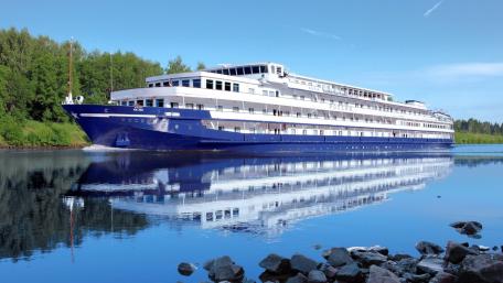 Majestic Cruise Ship on a Serene River wallpaper