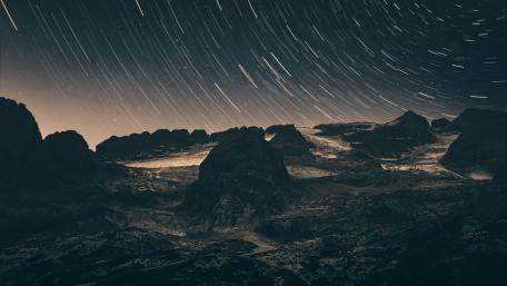 Star Trails Over Mountain Peaks wallpaper