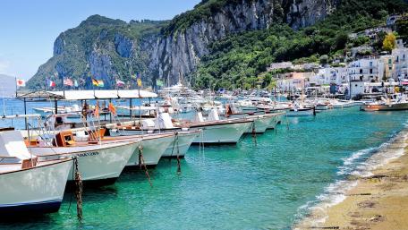 Capri's Scenic Dock with Motorboats wallpaper