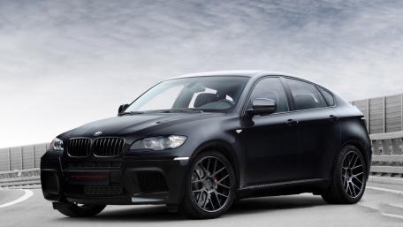 Sleek BMW X6 M in Midnight Black wallpaper