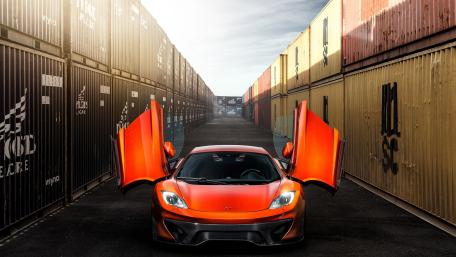 Sleek McLaren MP4-12C in Urban Setting wallpaper