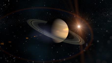 Saturn's Cosmic Dance in Space wallpaper