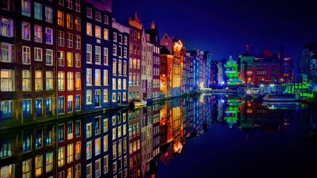 Amsterdam's Vibrant Night Reflection in 5K Detail wallpaper