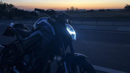 Sleek Motorcycle Against a Stunning Sunset Scene wallpaper