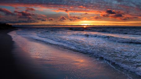 Burning Sky Over Tranquil Sea at Dusk wallpaper