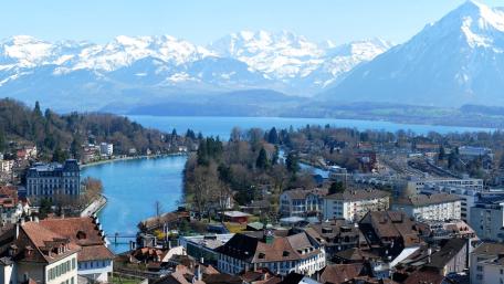 Thun and Thunersee with Majestic Alpine Backdrop wallpaper