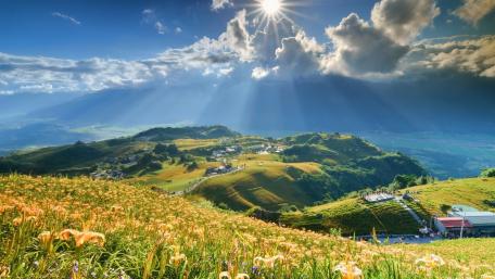 Golden Sunlight Over Serene Valley Hills wallpaper
