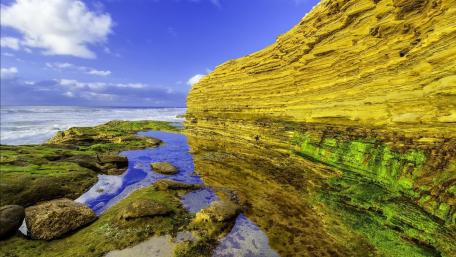 Majestic Coastal Rock Formation by the Sea wallpaper