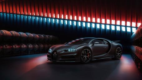 Sleek Bugatti Chiron in a Shadowy Garage Ambience wallpaper