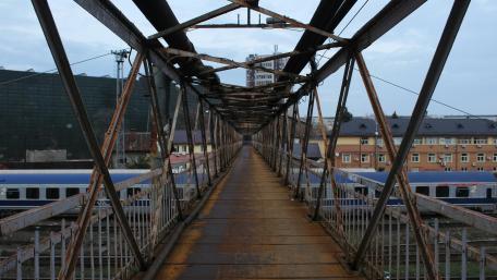 Rusty Truss Bridge in Urban Landscape wallpaper