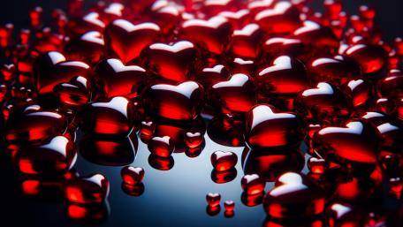 Chrystal hearts on a reflective surface wallpaper