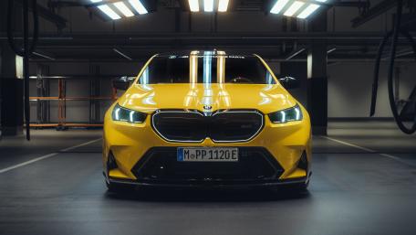 BMW M5 in Vibrant Yellow Front View wallpaper