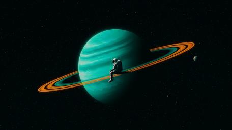 Astronaut's Cosmic Relaxation on a Ringed Planet wallpaper