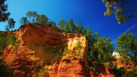 Colorful Cliffs Against a Vibrant Blue Sky wallpaper