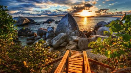 Sunset Over Boulders at Tranquil Bay wallpaper