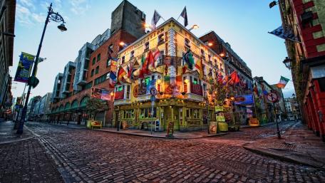 Colorful Flags Adorn Dublin Hostel Facade wallpaper