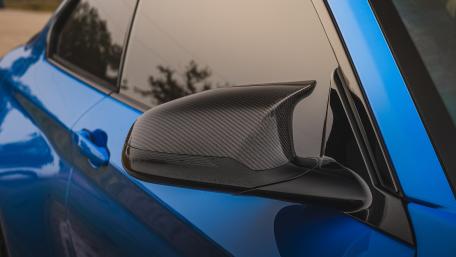 Sleek Blue Car Side Mirror Design wallpaper