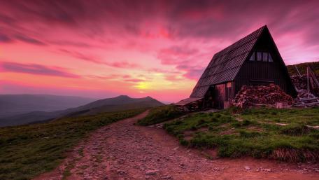 Cottage at Sunset with Pink Skies in Rural Landscape wallpaper