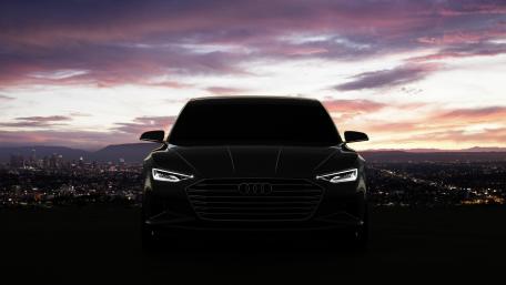 Sleek Audi Silhouette Against Dusk Skyline wallpaper