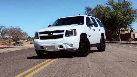Sleek White Chevrolet SUV on the Road wallpaper