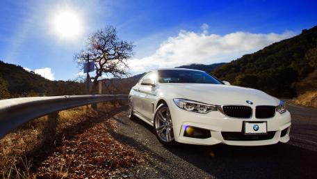 Sleek White BMW on Scenic Drive wallpaper