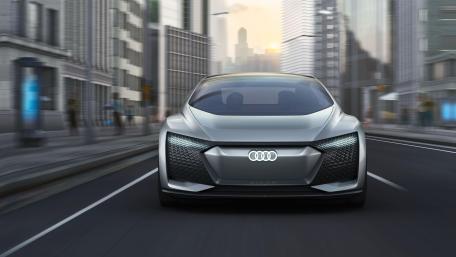 Futuristic Elegance Audi Aicon on Urban Roads wallpaper