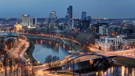 Vilnius Skyline at Dusk with Neris River Reflections wallpaper