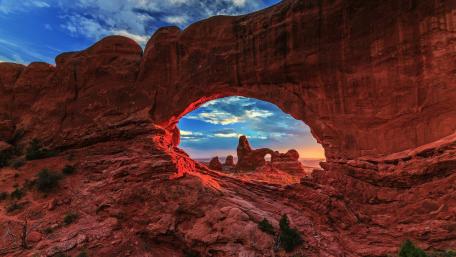 Turret Arch Through North Window's Embrace in Sunset Glow wallpaper