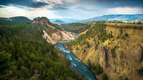 Serene River Bend in Yellowstone's Vivid Landscape wallpaper