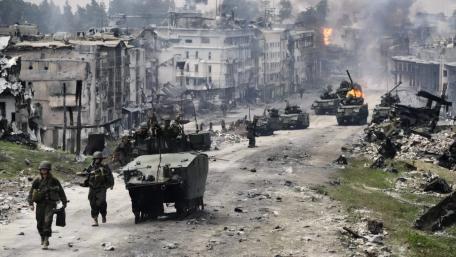 Urban Warfare Tactics in a Devastated City Scene wallpaper