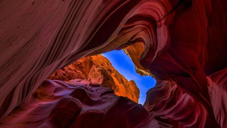 Antelope Canyon's Majestic Rock Formations and Sky wallpaper