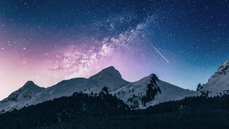 Mountain Peaks Under a Starry Night Sky wallpaper