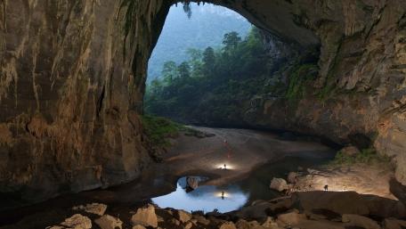 Majestic Cave Portal to Verdant Wilderness wallpaper