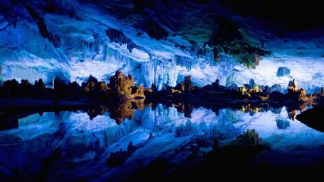 Enchanted Reflections Inside Reed Flute Cave wallpaper