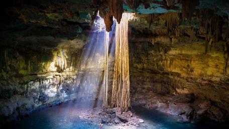 Sunlit Sanctuary in Hidden Cave wallpaper