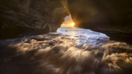 Serene Sunset Over the Sea Cave wallpaper