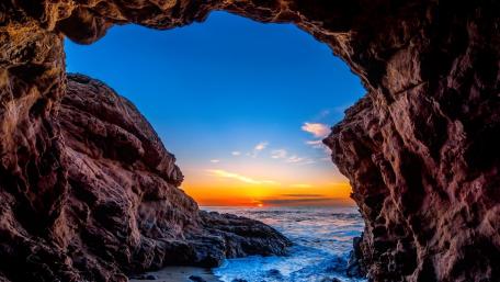 Stunning Sunrise Over the Sea Cave View wallpaper