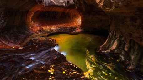 Mystical Cave Reflection in Nature's Embrace wallpaper