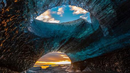 Stunning Ice Cave with Blue Rock Elements wallpaper