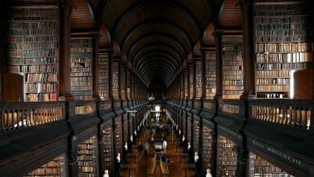 Majestic Library with Endless Bookcase Shelving wallpaper