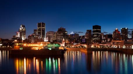 Montreal's Nighttime Skyline Reflecting Serenity wallpaper