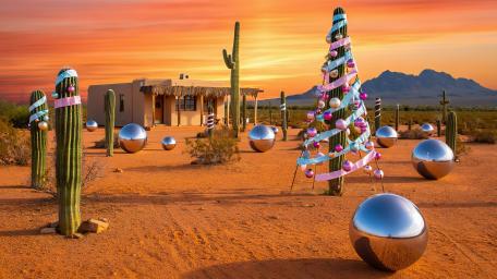 Surreal Desert Celebration with Cacti and Spheres wallpaper