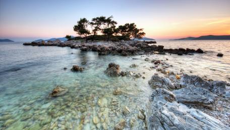 Serene Island Escape Under Sunset Skies wallpaper