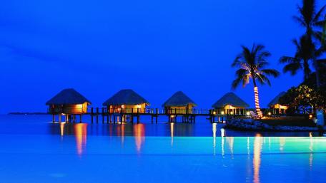 Overwater Bungalows at Dusk in Tropical Paradise wallpaper