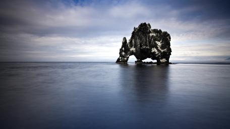 Hvítserkur Sea Stack Under Vast Sky in Iceland's Wilderness wallpaper