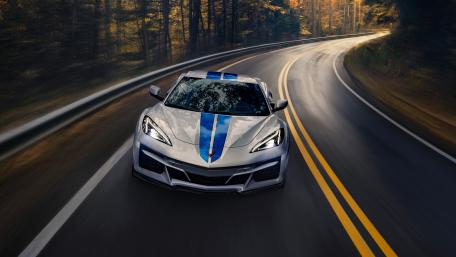 Chevrolet Corvette E-Ray Speeding on Scenic Road wallpaper