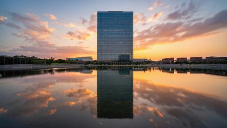 Skyscraper Serenity in Sunset Reflection wallpaper