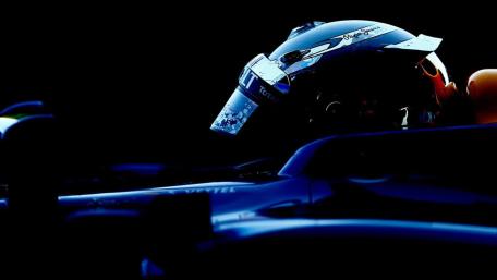 Formula One Driver in Dynamic Motion wallpaper